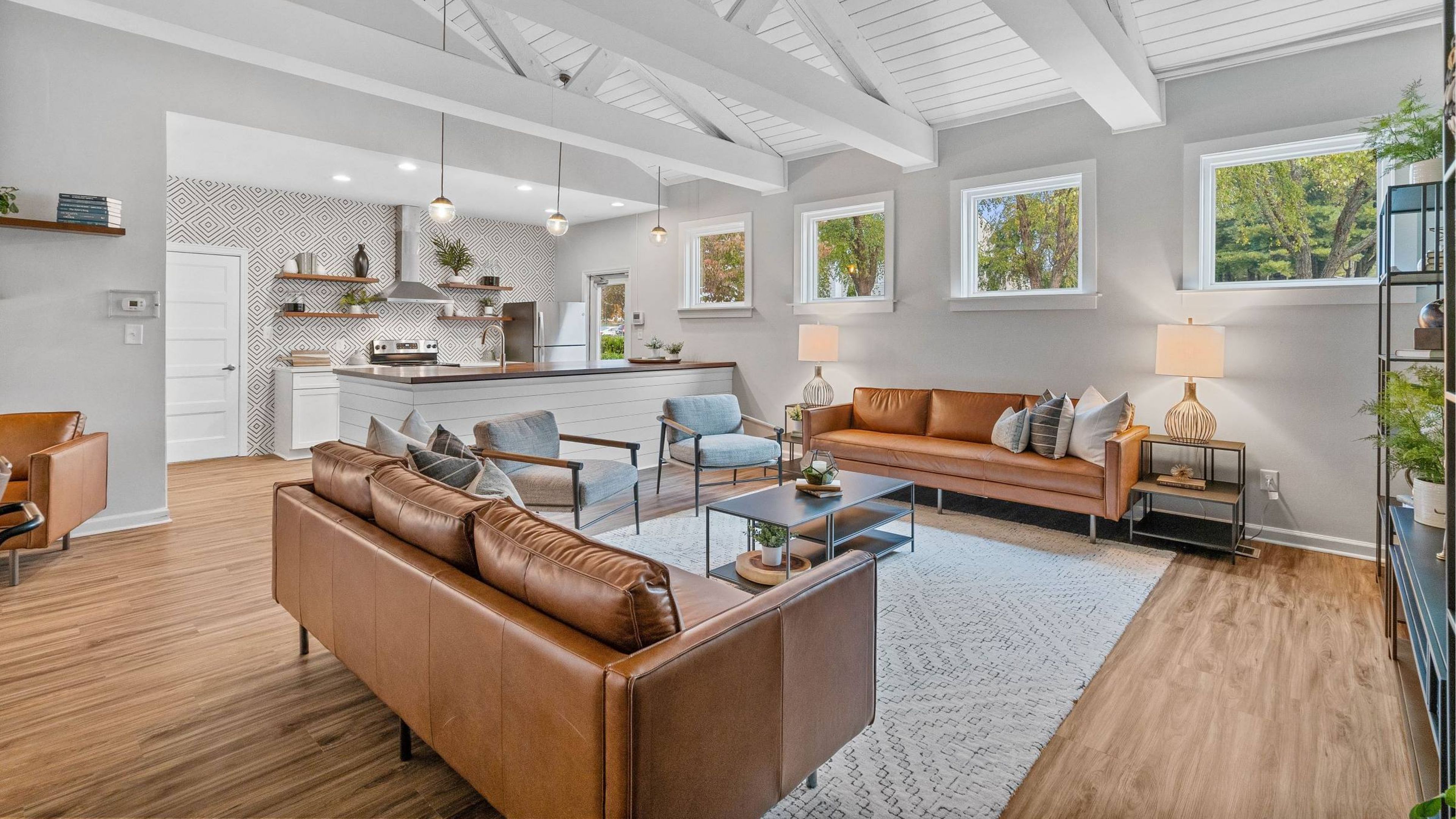 Hawthorne at Southside offers an inviting clubhouse lounge showcasing a kitchen area and plush couches